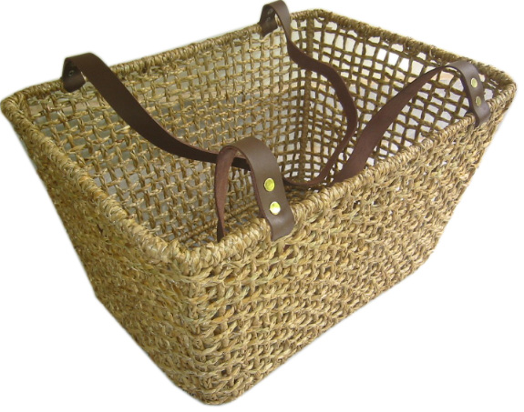 Shopping basket made of reed with two leather straps